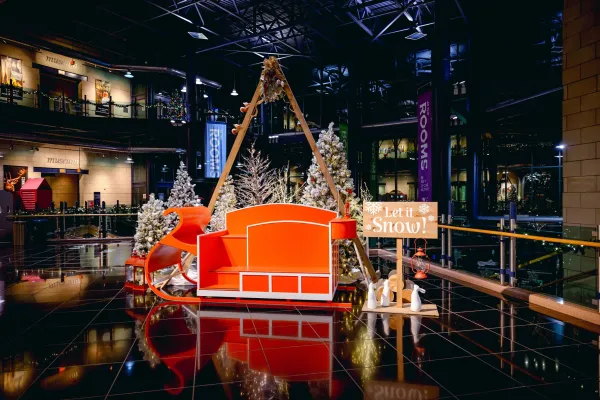 red sleigh with trees around it at The Rooms